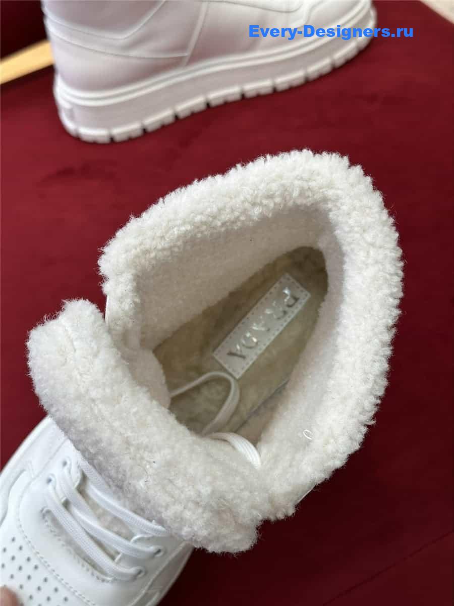 Pra*a white triangle-logo high-top leather sneakers