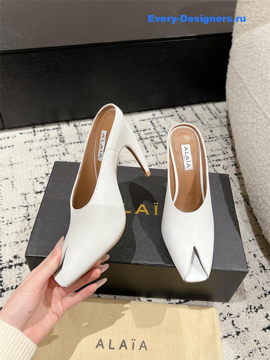 Alaia White Spike Mules in Calfskin