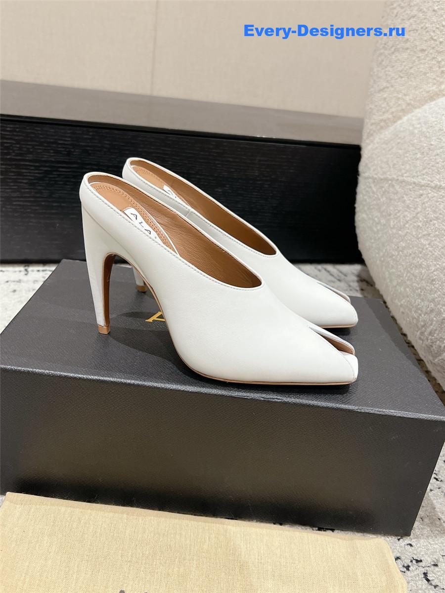 Alaia White Spike Mules in Calfskin