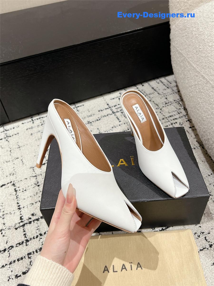 Alaia White Spike Mules in Calfskin