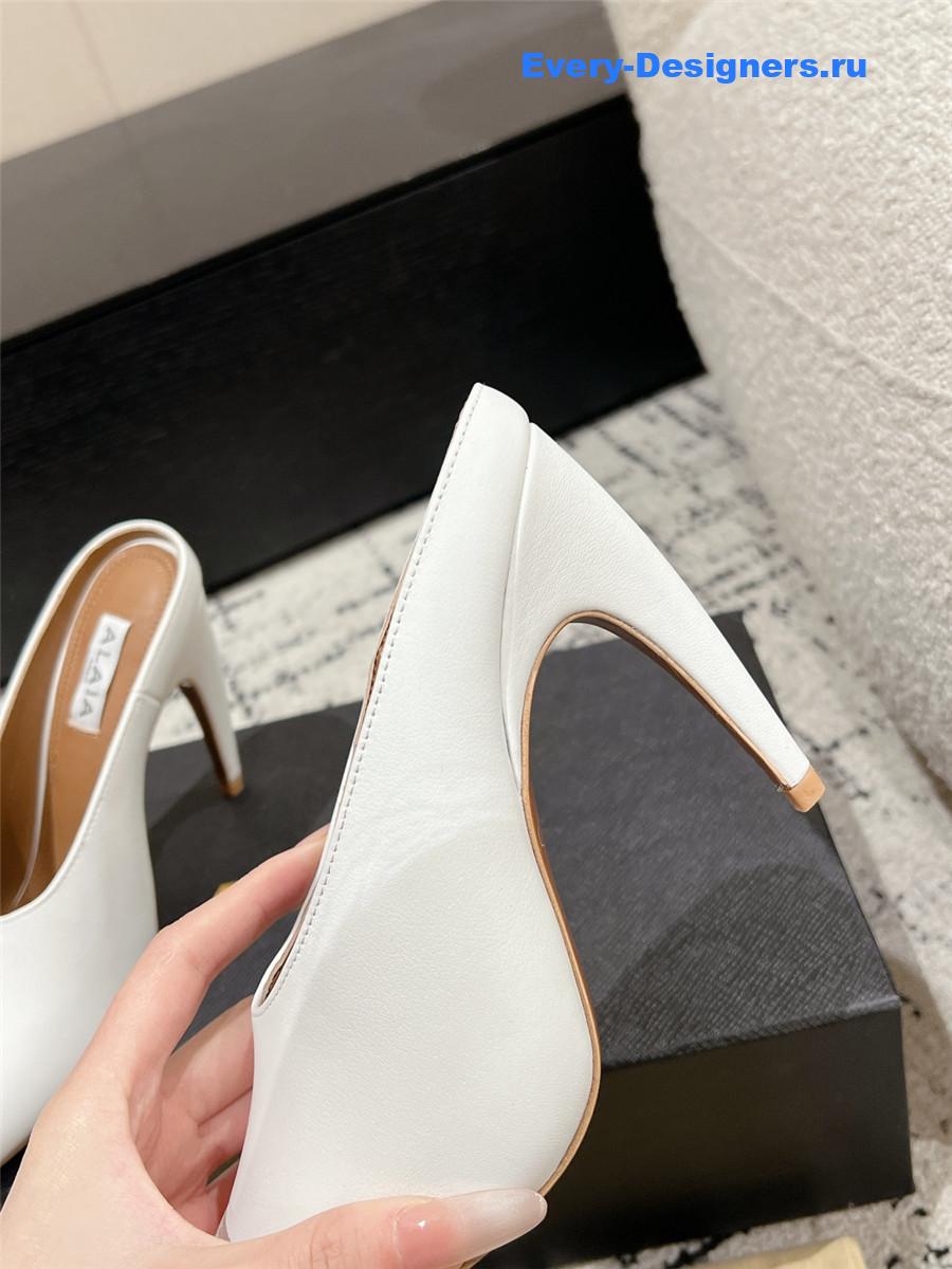 Alaia White Spike Mules in Calfskin