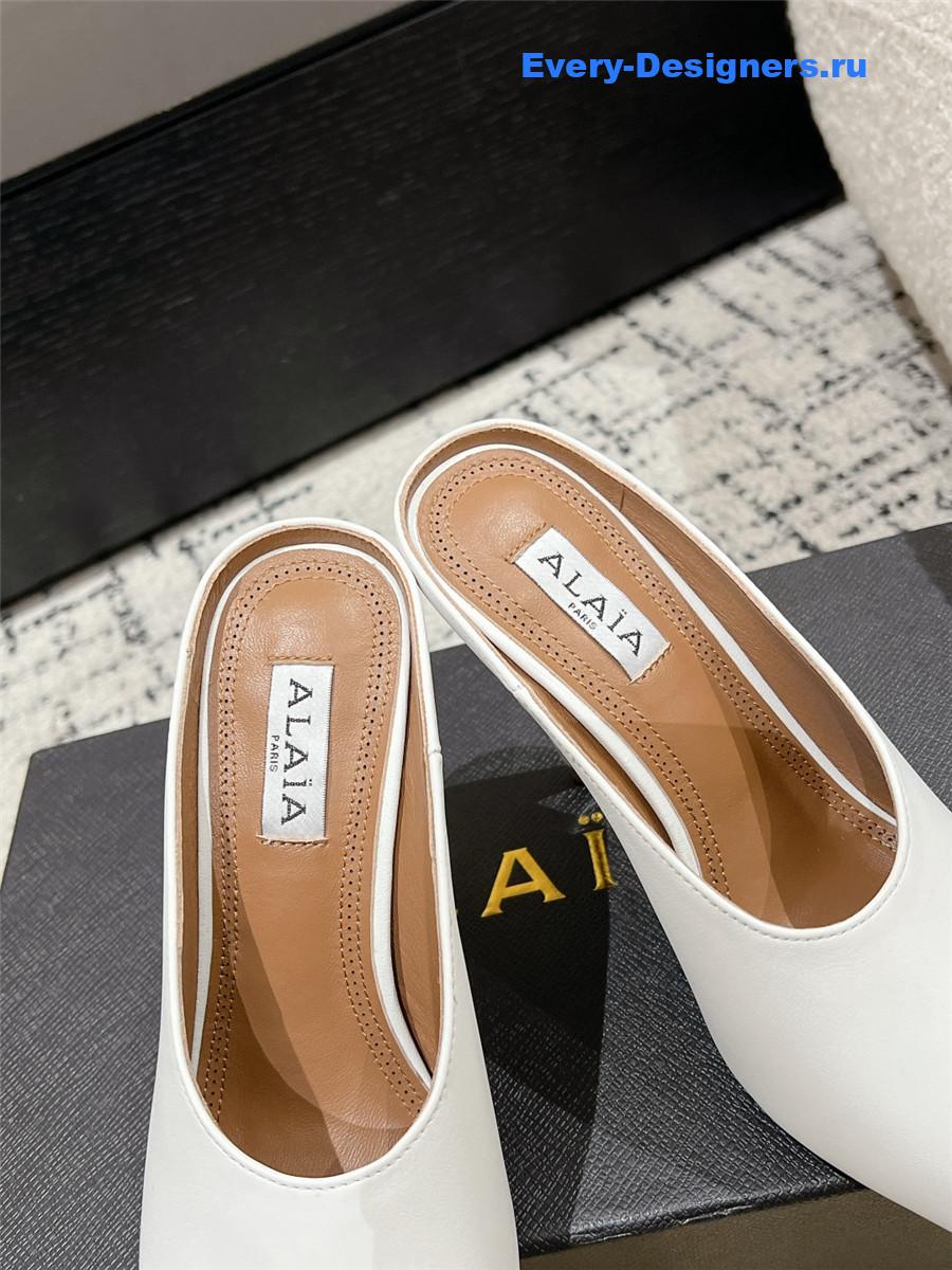 Alaia White Spike Mules in Calfskin