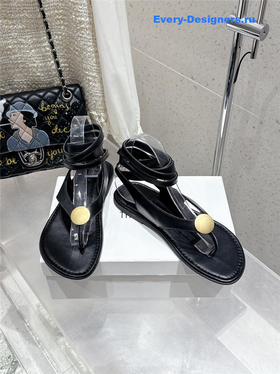 The R0w black strap flip flop flat sandals