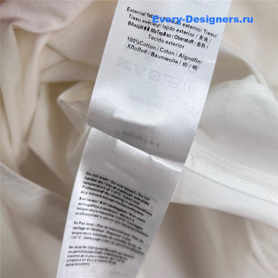 Va1e*ntin0 ruffled mini dress in white