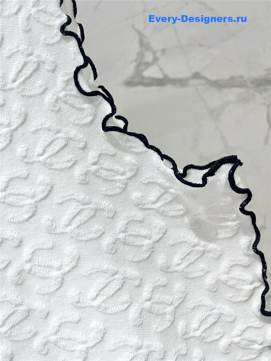 Ch**el embroidered wool-silk top in white