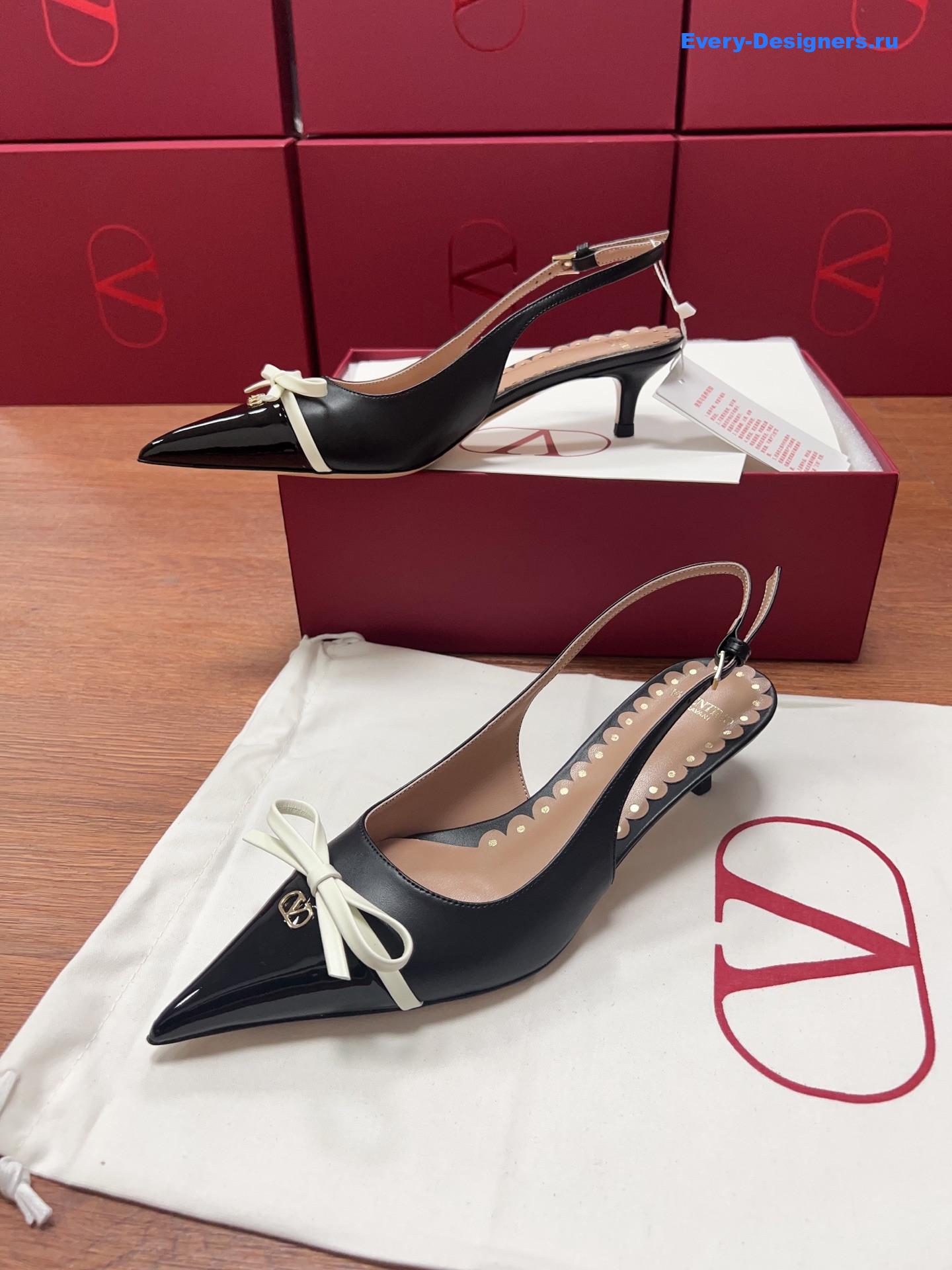 Va1e*ntin0 garavani bow slingback pumps in black