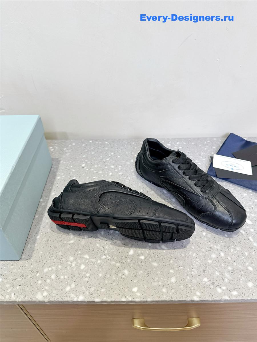 Pra*a black leather low-top sneakers