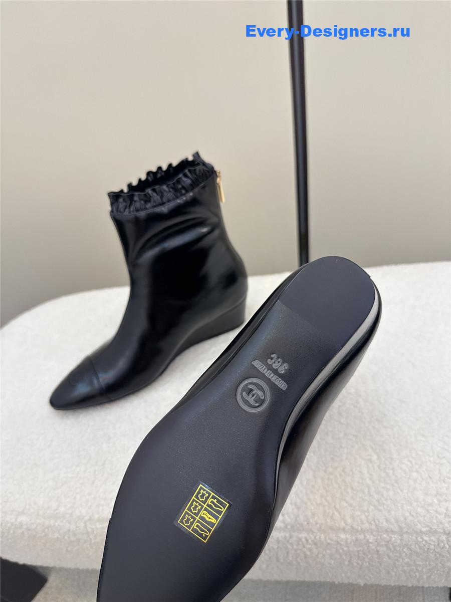 Ch**el black pointed wedge ankle boots