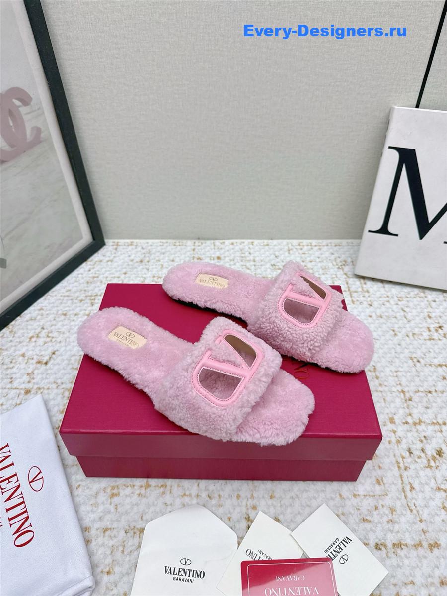 Va1e*ntin0 pink vlogo cutout faux shearling slides