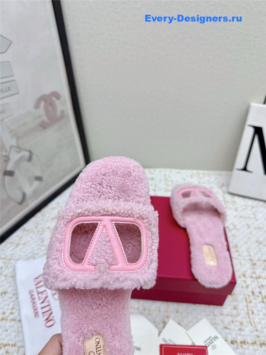 Va1e*ntin0 pink vlogo cutout faux shearling slides